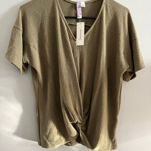Olive green crop top with front knot. Never worn. Tag still on item. Francesca’s